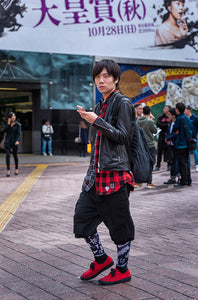 Young man in red shoes